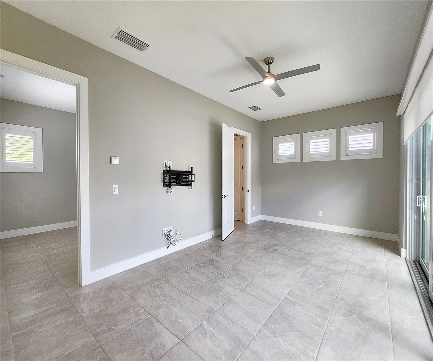 Guest House measures approximately 20x23, includes 1 bedroom, 1 full bathroom, living room, impact glass sliders with remote controlled shades. - 8896 DRUMMER PLANK DR, WESLEY CHAPEL
