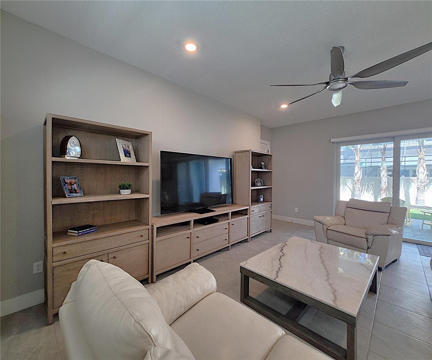 Main home: plantation shutters, remote controlled shade, large living room, dining area, large open kitchen, 3 bedrooms, 2 full bathrooms, 1 guest bathroom, interior laundry room - 8896 DRUMMER PLANK DR, WESLEY CHAPEL
