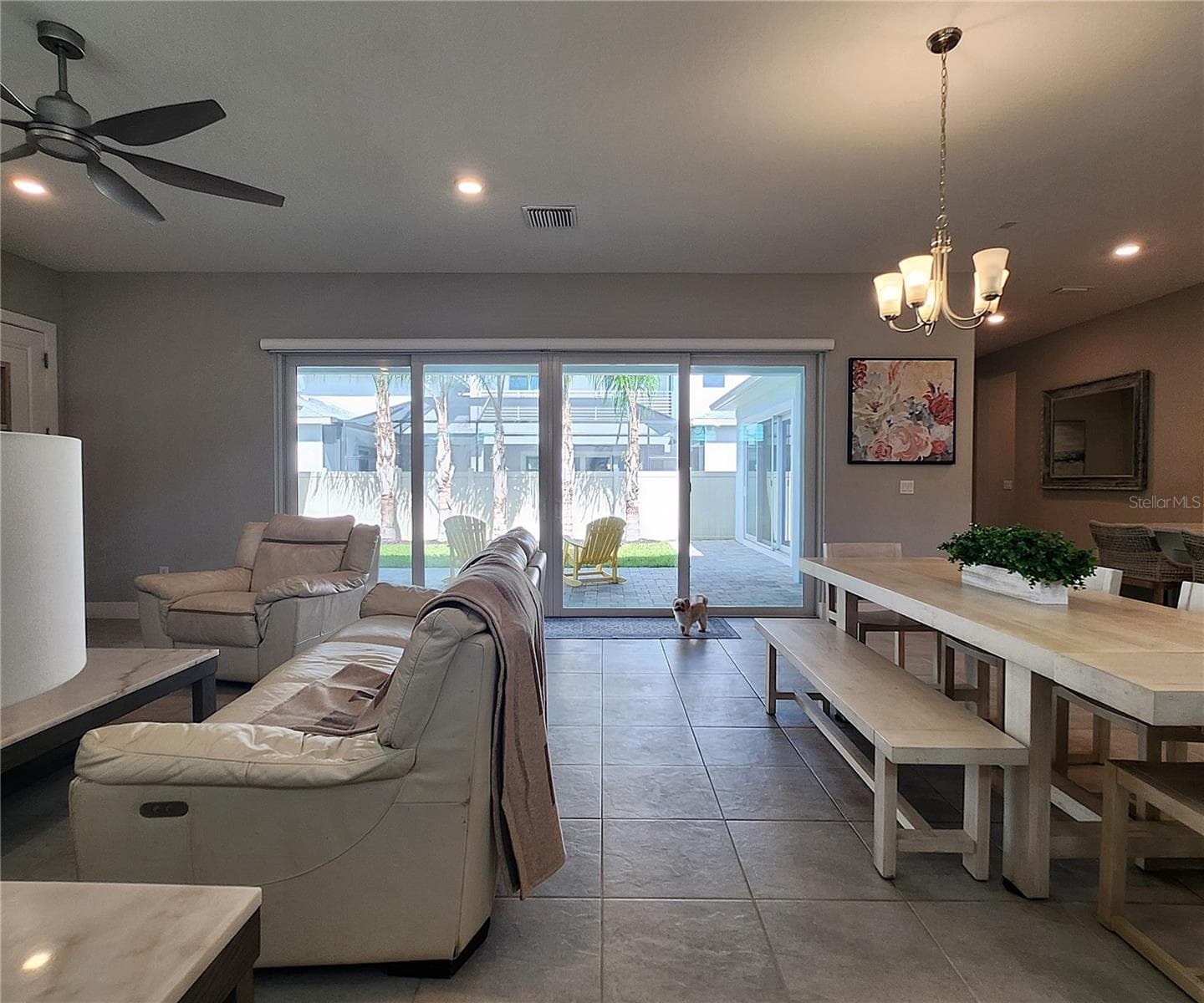 Main home: plantation shutters, remote controlled shade, large living room, dining area, large open kitchen, 3 bedrooms, 2 full bathrooms, 1 guest bathroom, interior laundry room - 8896 DRUMMER PLANK DR, WESLEY CHAPEL