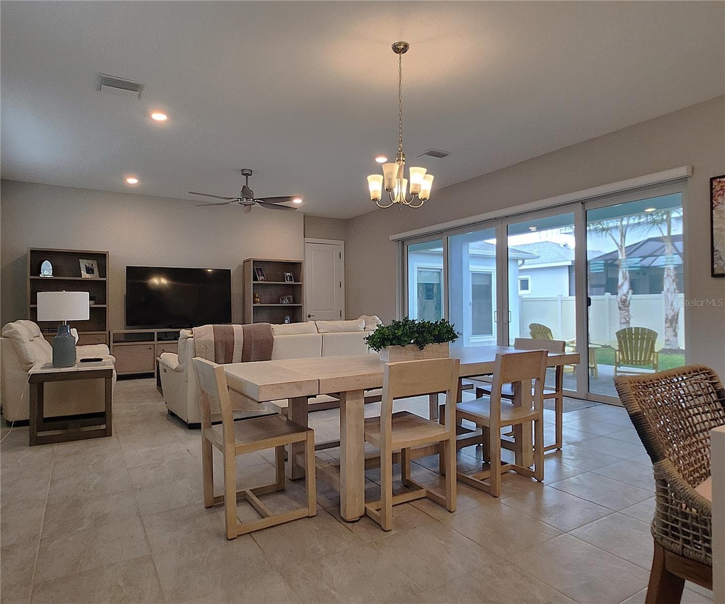 Main home: plantation shutters, remote controlled shade, large living room, dining area, large open kitchen, 3 bedrooms, 2 full bathrooms, 1 guest bathroom, interior laundry room - 8896 DRUMMER PLANK DR, WESLEY CHAPEL