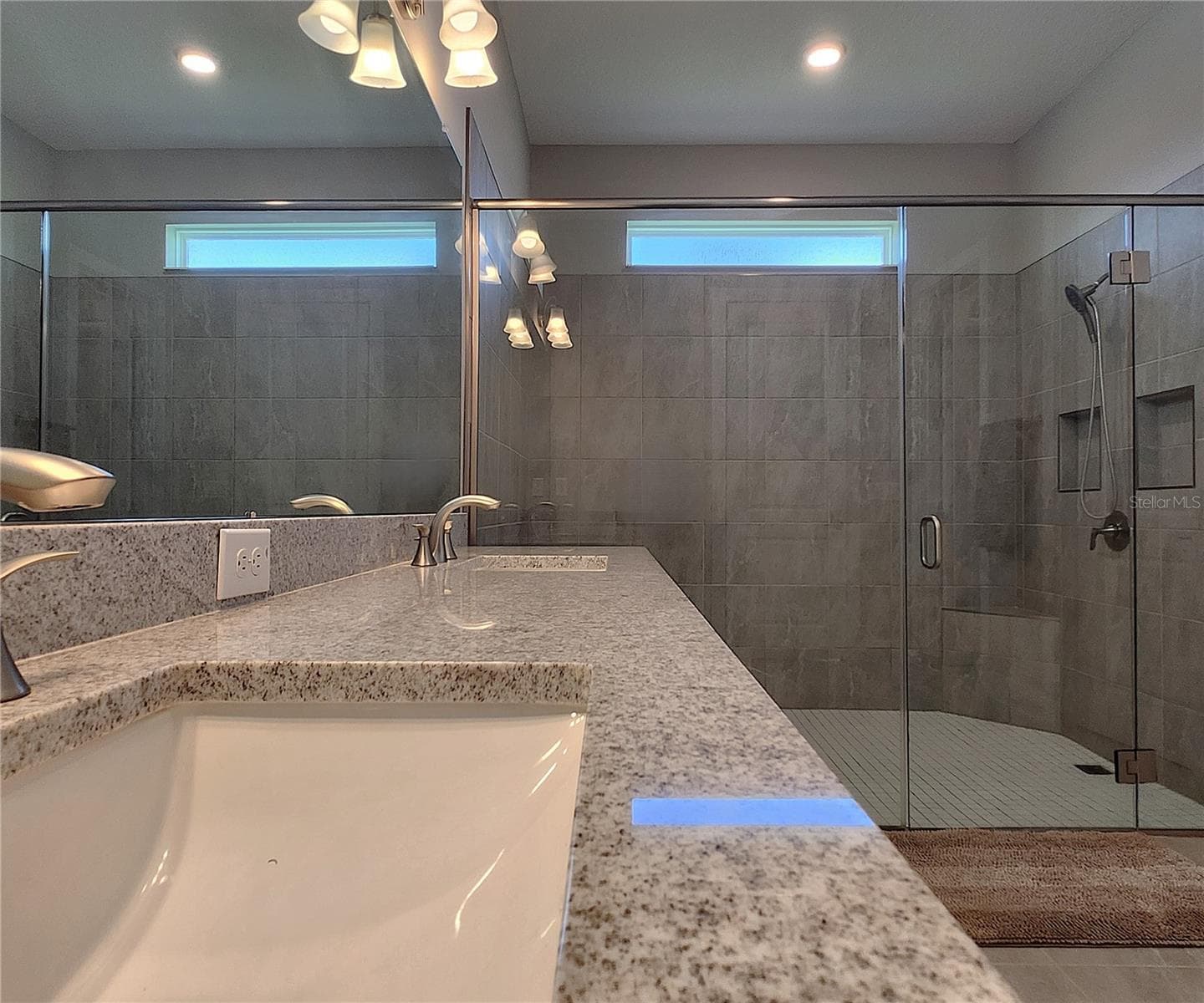 Master bathroom includes large walk-in tiled shower, water closet, walk-in closet, dual sink vanity, granite countertops - 8896 DRUMMER PLANK DR, WESLEY CHAPEL