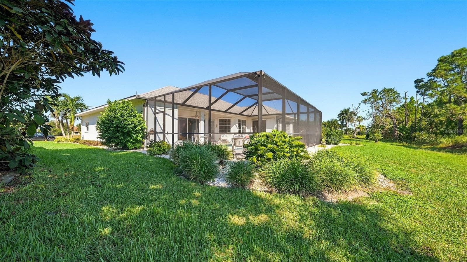 simple landscaping - 12 MEDALIST CT, ROTONDA WEST