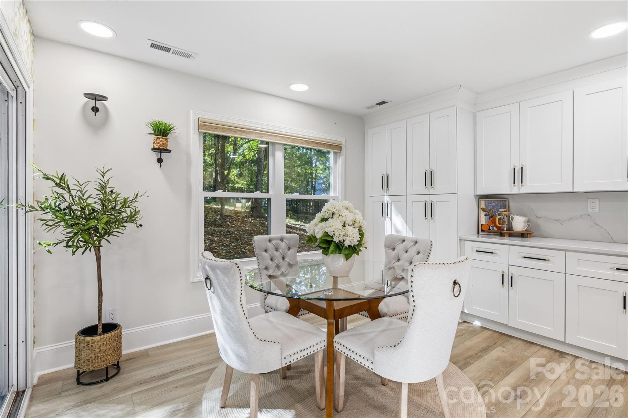 Open to the patio, the breakfast nook is a sunny retreat for coffee or casual meals - 16 Tanglewood Road, Lake Wylie