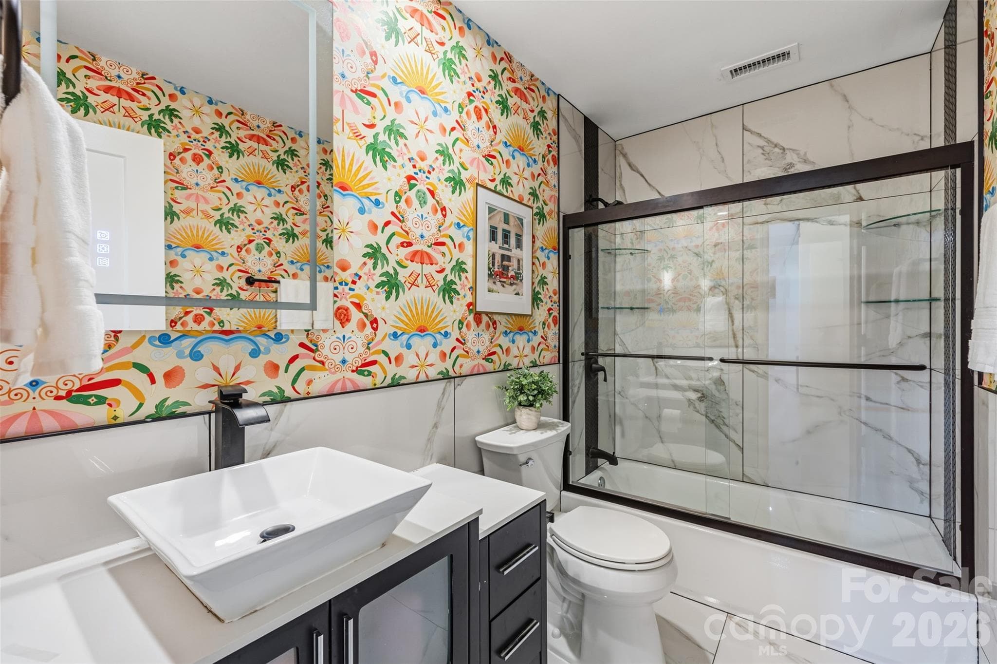 Updated finishes and a glass-enclosed shower. Playful wallpaper makes this space fun! - 16 Tanglewood Road, Lake Wylie