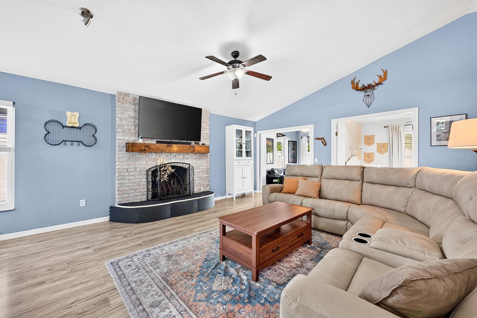 Living area is complete with a fireplace. - 9807 PINEY POINT CIR, ORLANDO