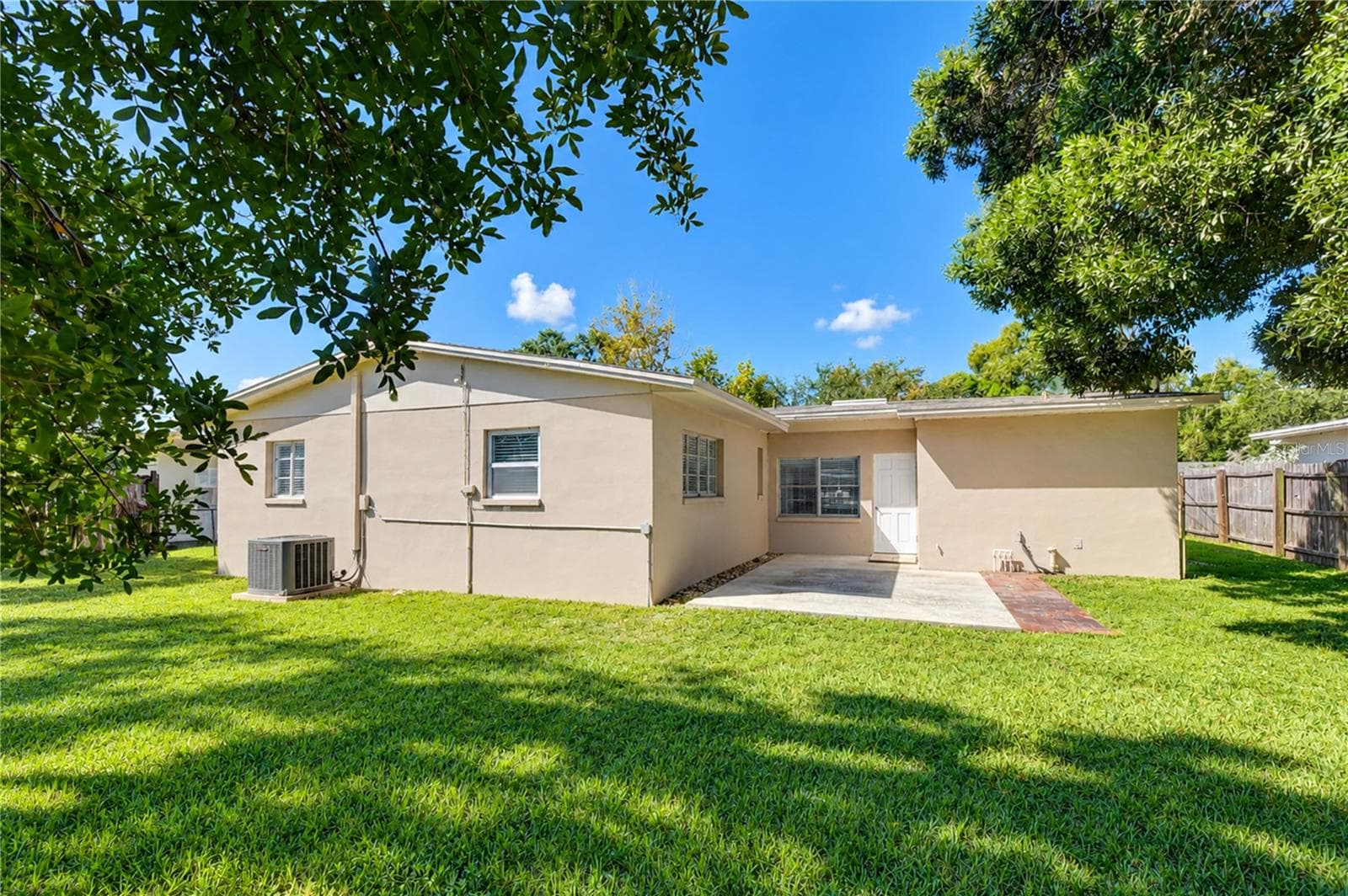 Generous patio space ideal for outdoor dining and entertaining. - 4508 S LOIS AVE, TAMPA