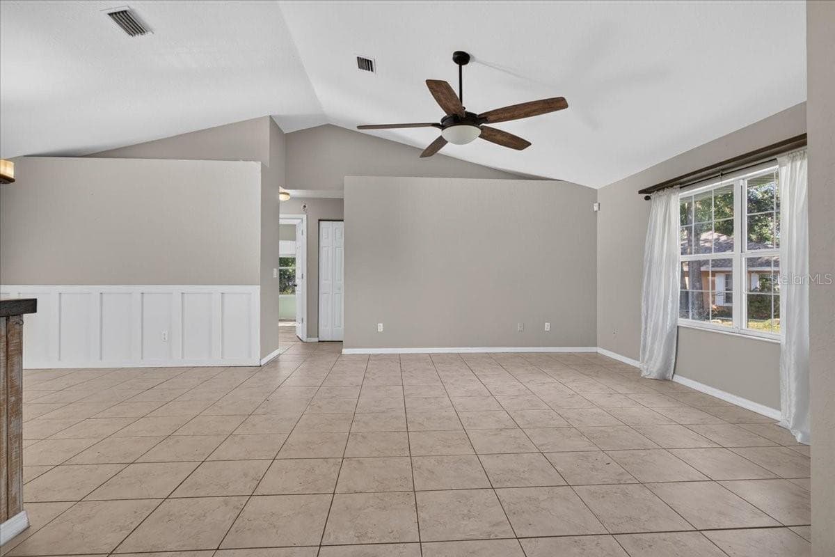 Living room and dining room from front door - 10687 SW 74TH TER, OCALA