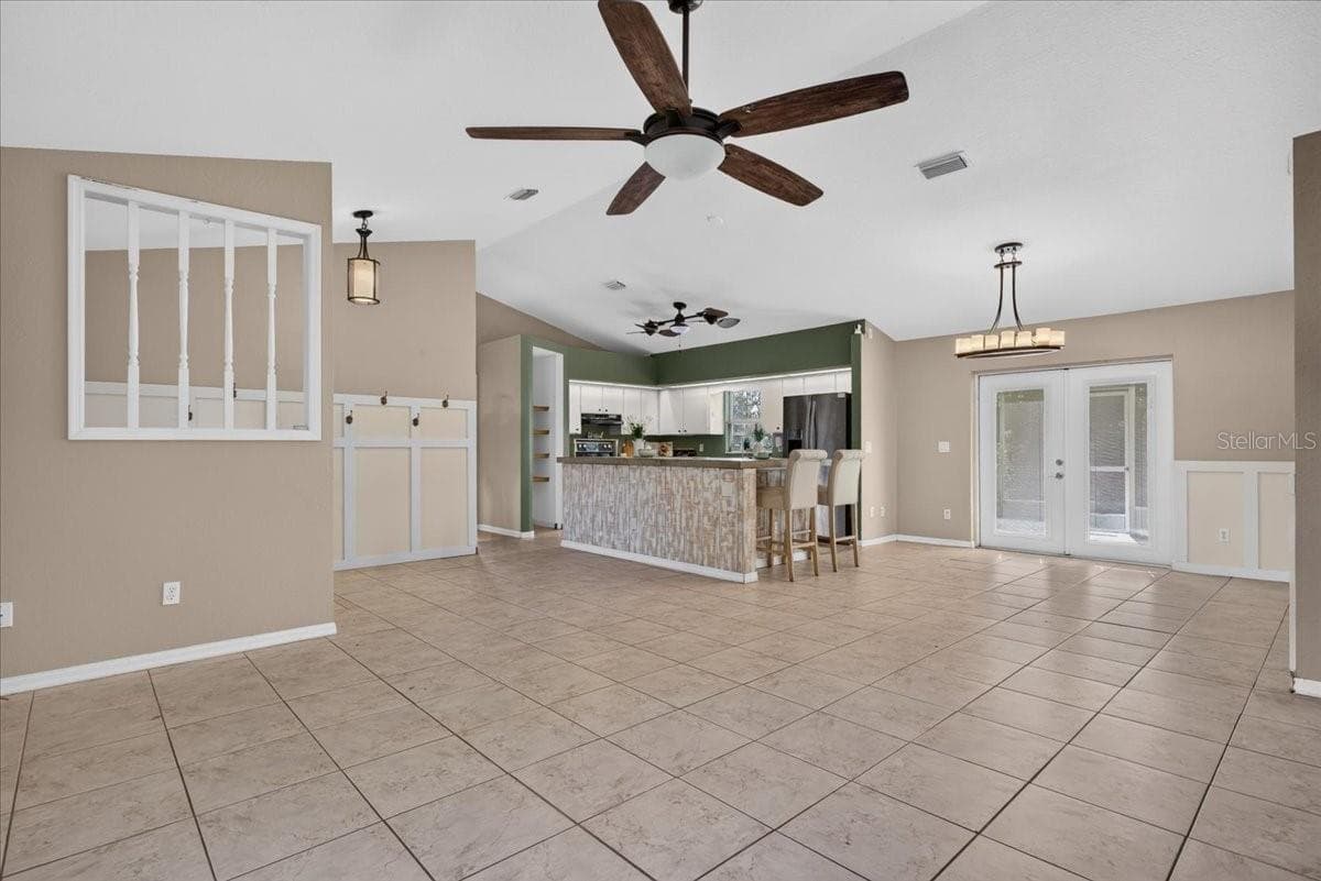 Family room toward kitchen - 10687 SW 74TH TER, OCALA