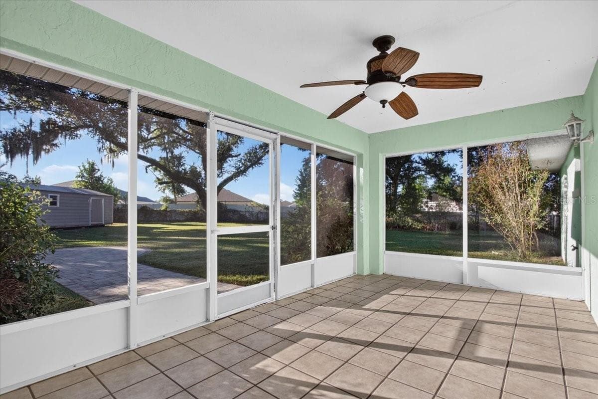 Relax on the bug-free back porch! - 10687 SW 74TH TER, OCALA