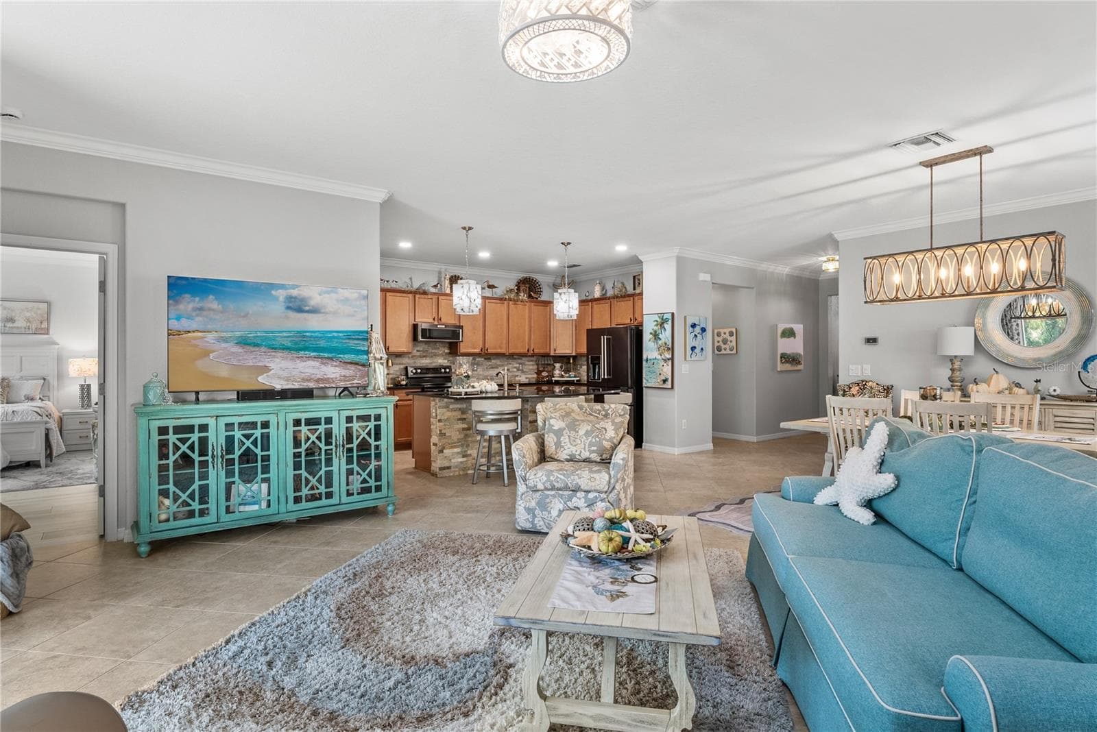 Facing into home with dining and kitchen behind - 7122 MARSH VIEW TER, BRADENTON