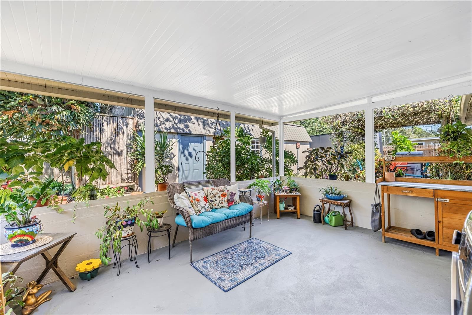 Peaceful covered back porch right out of the kitchen - 2573 62ND TER N, ST PETERSBURG
