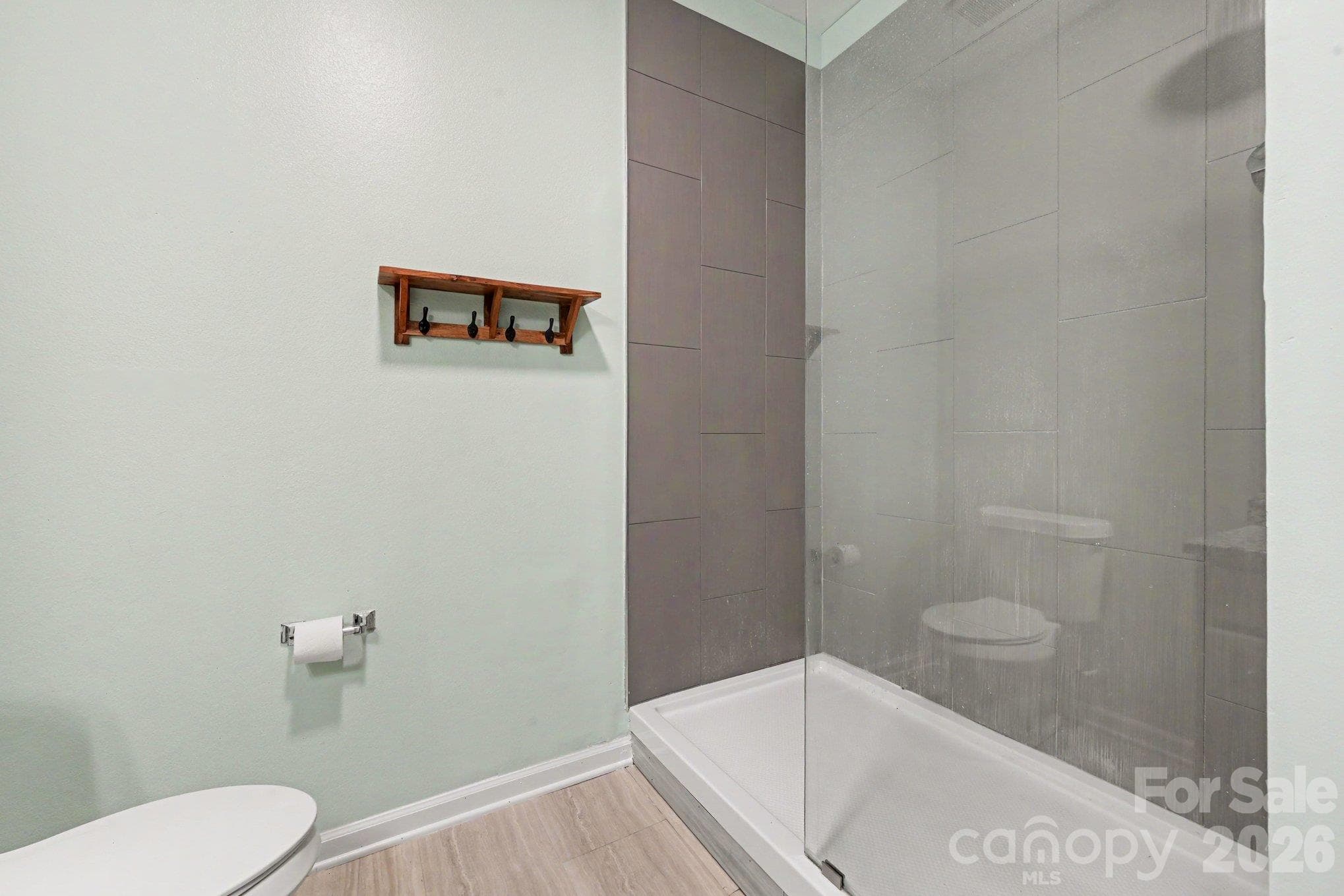 Modern walk-in shower in primary bathroon - 8334 Carob Tree Lane, Charlotte