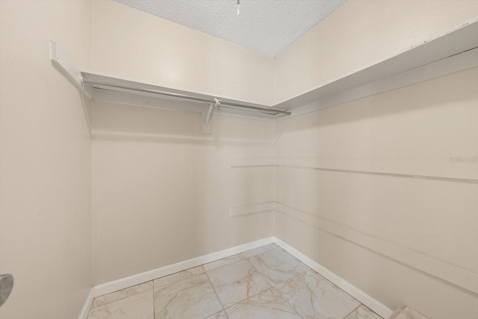 Primary suite walk in closet - 1706 BELLEAIR FOREST DR #238, BELLEAIR