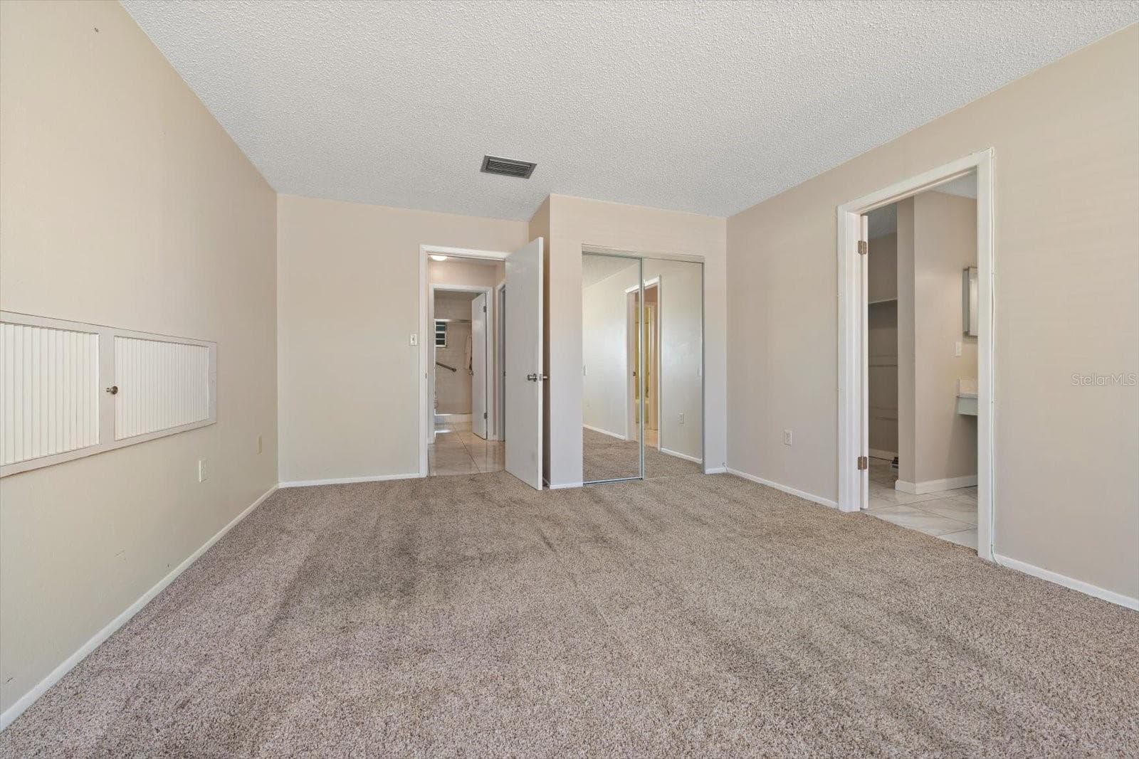 Primary suite with additional closet, en suite bath and walk in closet - 1706 BELLEAIR FOREST DR #238, BELLEAIR