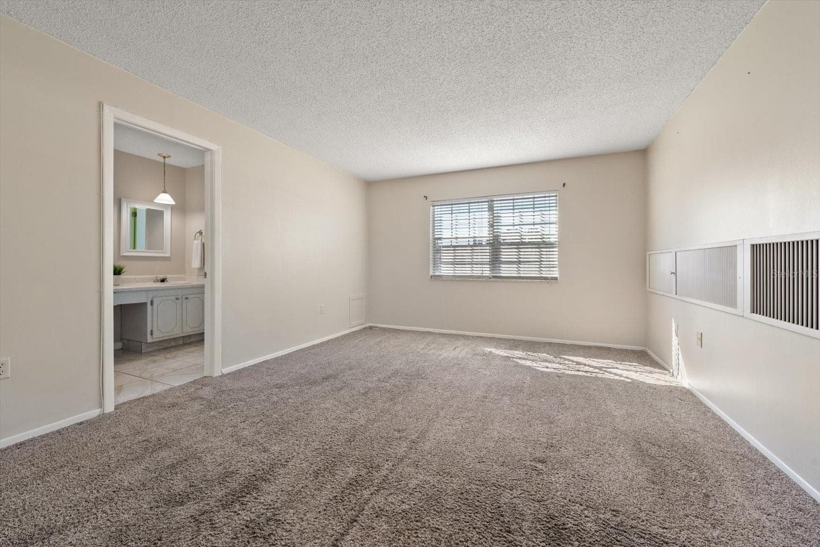 Primary suite with additional closet, en suite bath and walk in closet - 1706 BELLEAIR FOREST DR #238, BELLEAIR