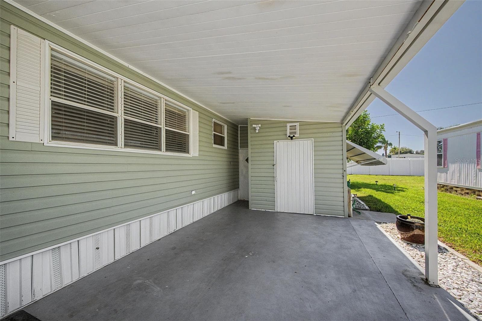 widened carport - 18 DRURY LN, TARPON SPRINGS
