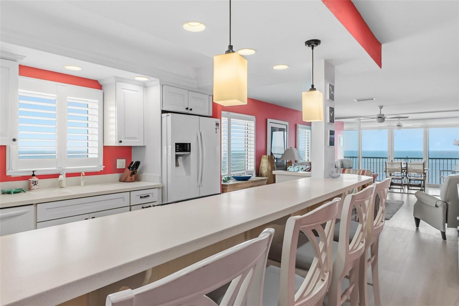The kitchen includes a bar for dining as well. - 555 THE ESPLANADE N #1001, VENICE