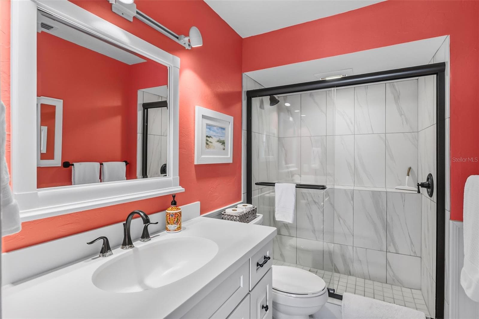 Your ensuite bathroom in the primary suite. - 555 THE ESPLANADE N #1001, VENICE