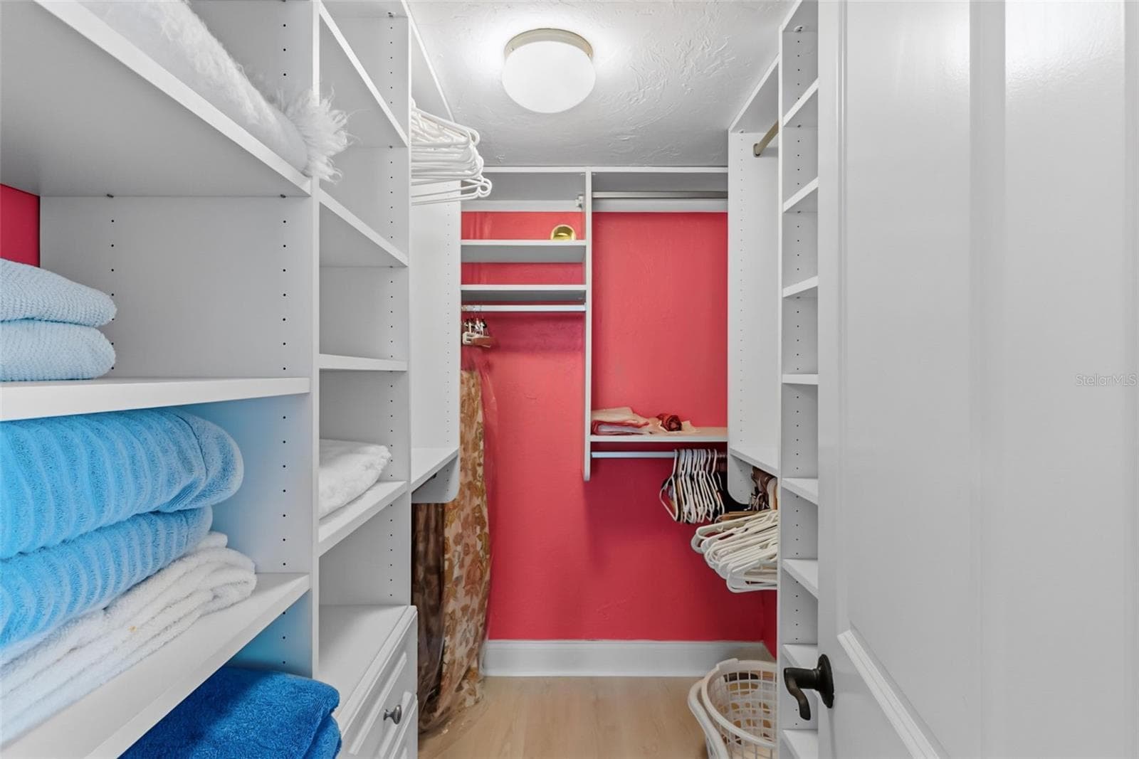 Your custom walk-in closet in the primary suite. - 555 THE ESPLANADE N #1001, VENICE