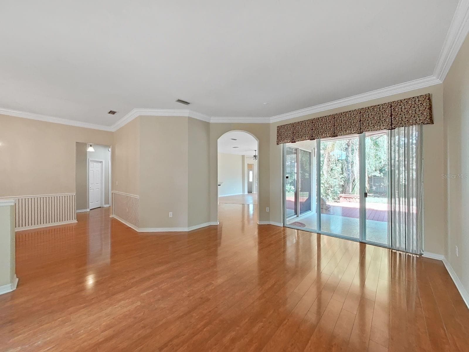 View from Living Room into Kitchen/Family Room and Doors to Lanai - 14915 DEVONSHIRE WOODS PL, TAMPA