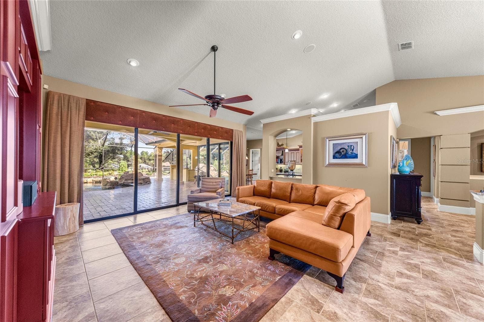 Recessed lighting, ceiling fan, and seamless across to the outdoor area. - 6501 SW 179TH AVENUE RD, DUNNELLON