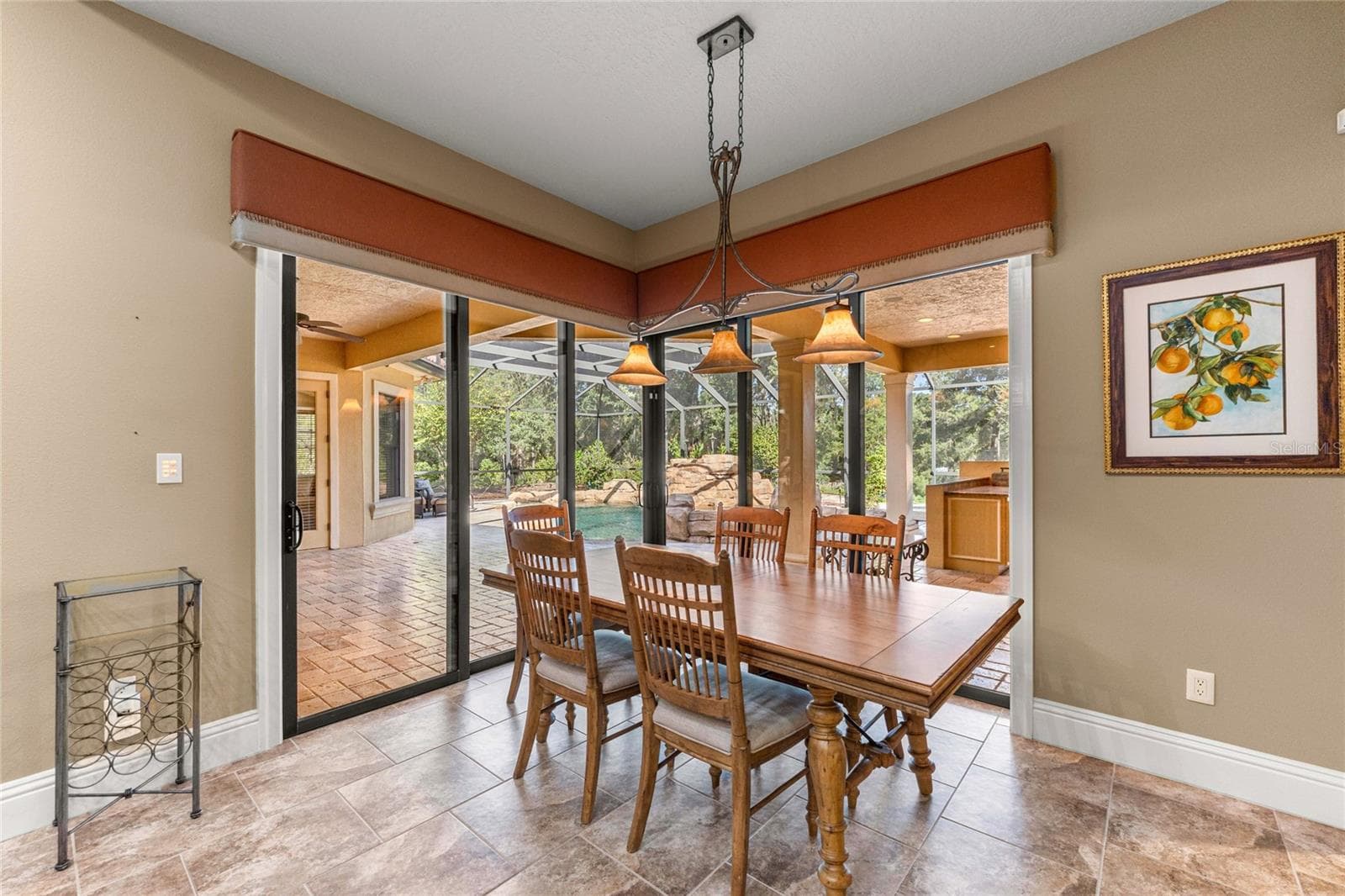Beautiful pool views from the dining area. - 6501 SW 179TH AVENUE RD, DUNNELLON