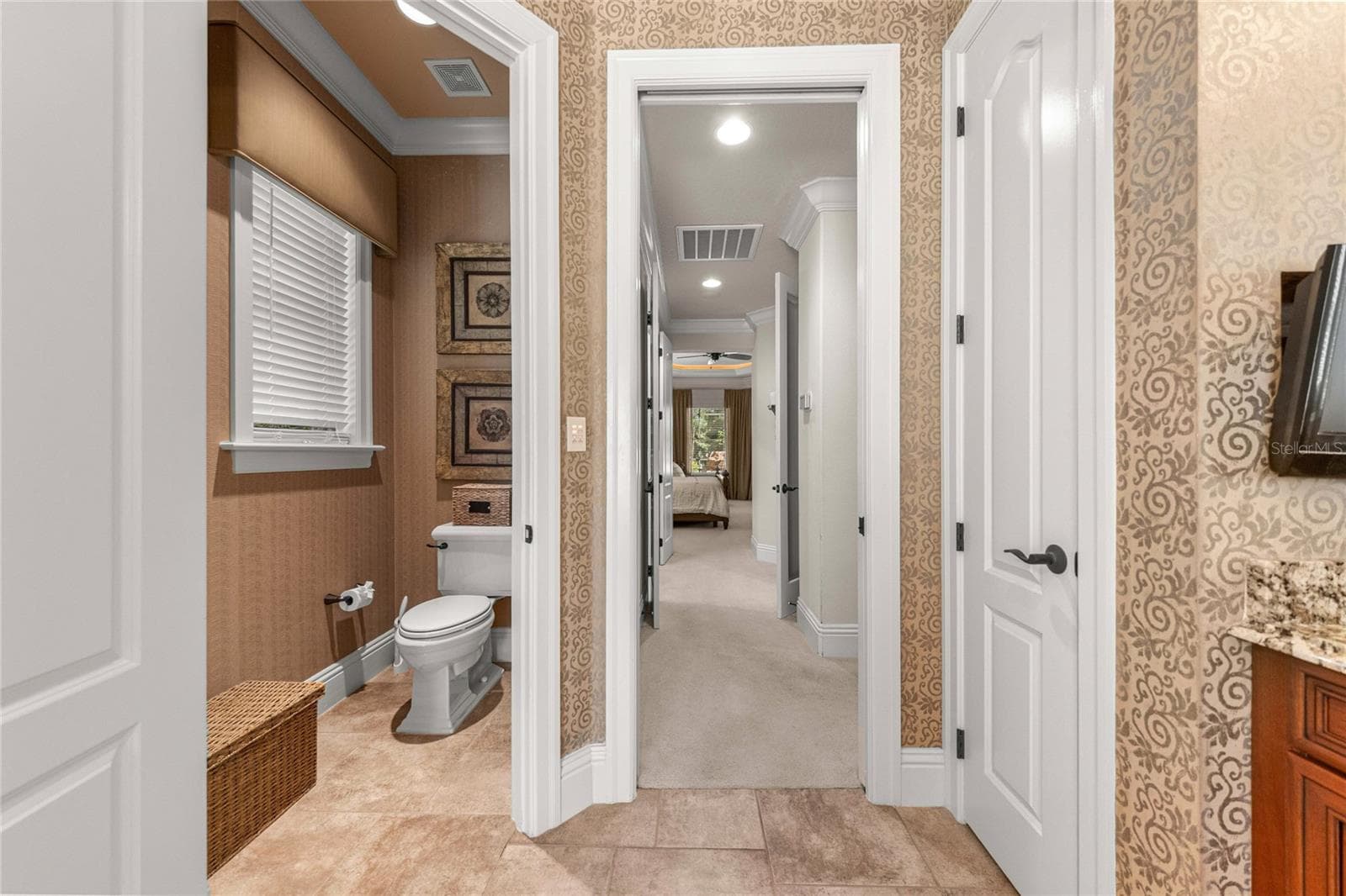 Thoughtfully designed owner's bathroom with separate water closet and convenient access to the primary suite. - 6501 SW 179TH AVENUE RD, DUNNELLON