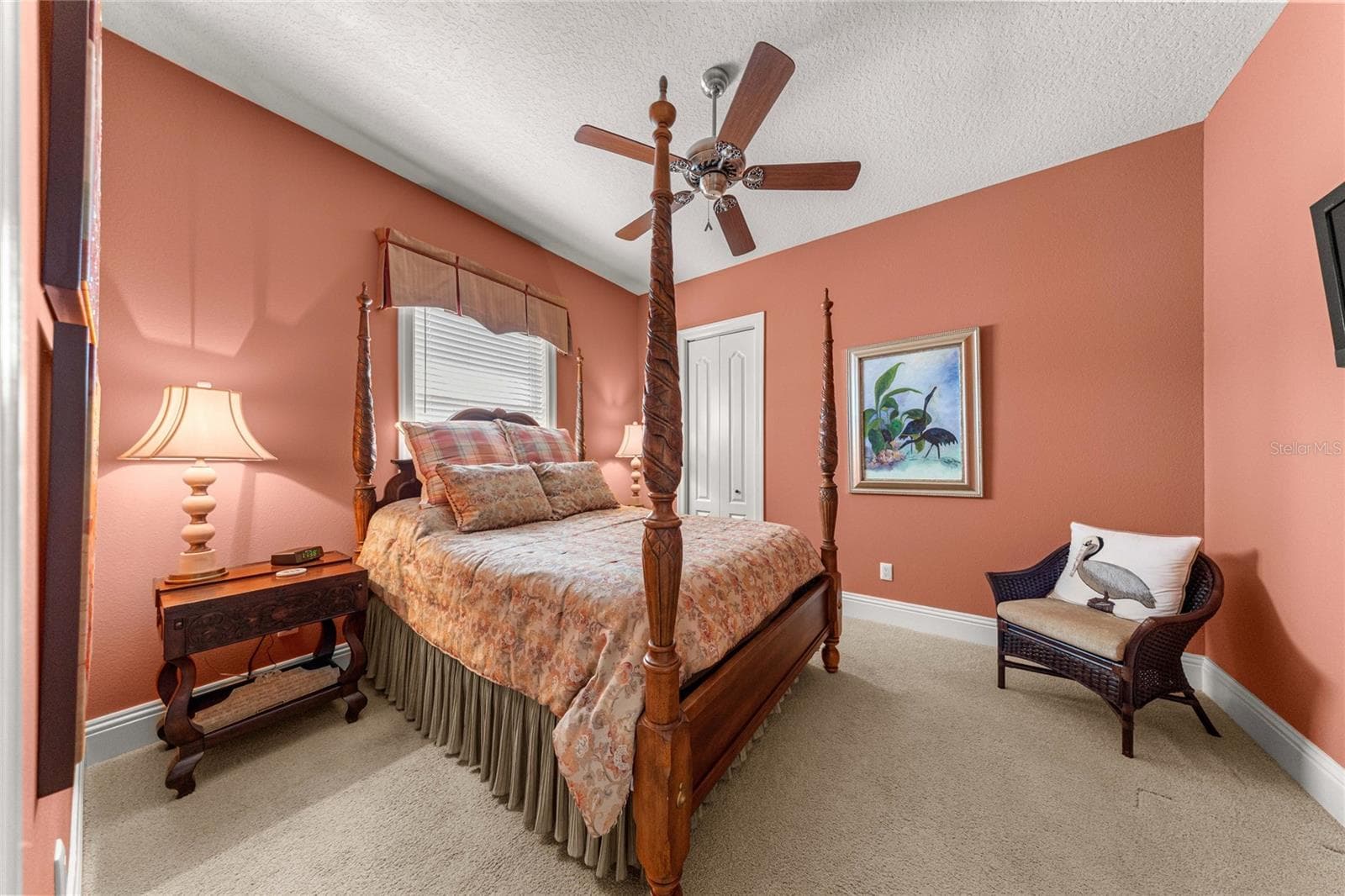 Inviting guest bedroom featuring warm designer colors, plush carpeting, ceiling fan. - 6501 SW 179TH AVENUE RD, DUNNELLON