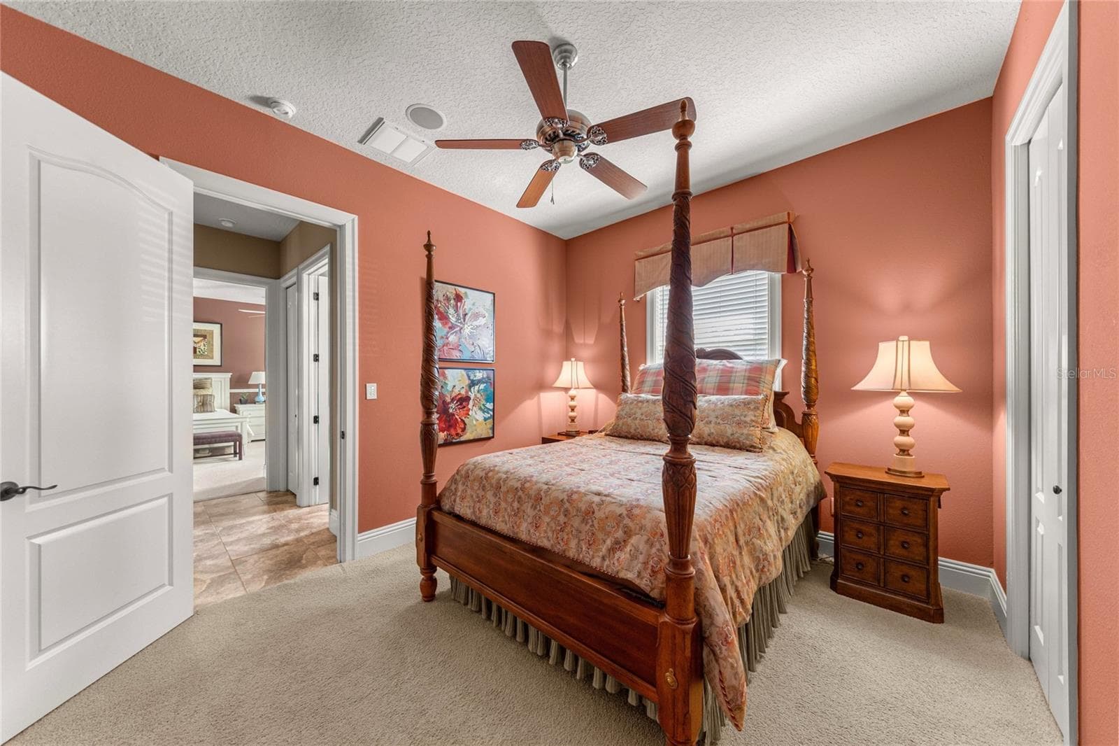 Additional view of the comfortable guest bedroom, showcasing its spacious layout, natural lighting, and convenient closet. - 6501 SW 179TH AVENUE RD, DUNNELLON