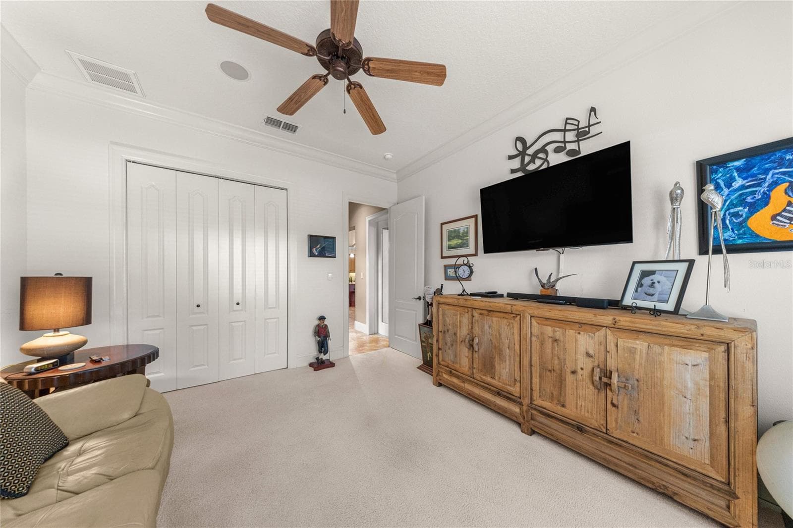 Additional bedroom abundant natural light, ceiling fan, and generous closet space. - 6501 SW 179TH AVENUE RD, DUNNELLON