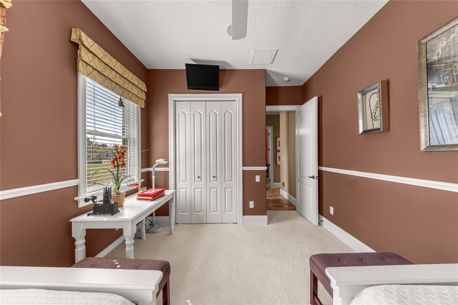 Another perspective of this versatile bedroom, highlighting its spacious layout, closet storage, and natural light. - 6501 SW 179TH AVENUE RD, DUNNELLON