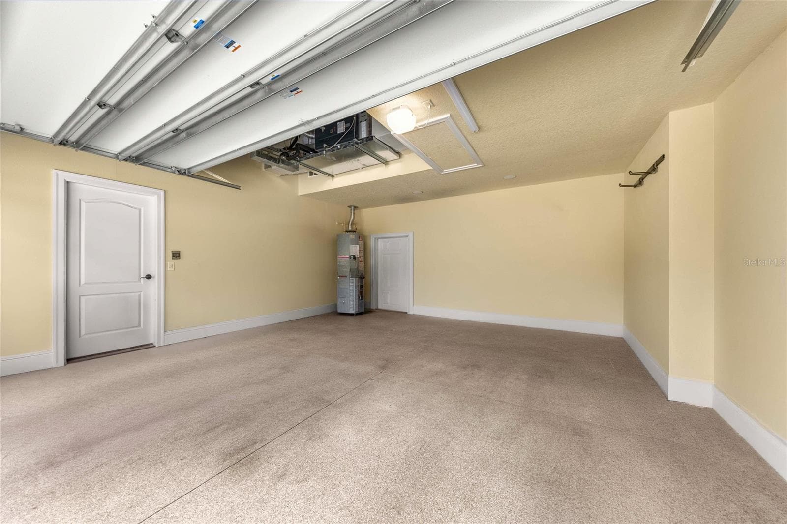 Garage – Spacious garage with finished walls and ample room for vehicles and storage. - 6501 SW 179TH AVENUE RD, DUNNELLON