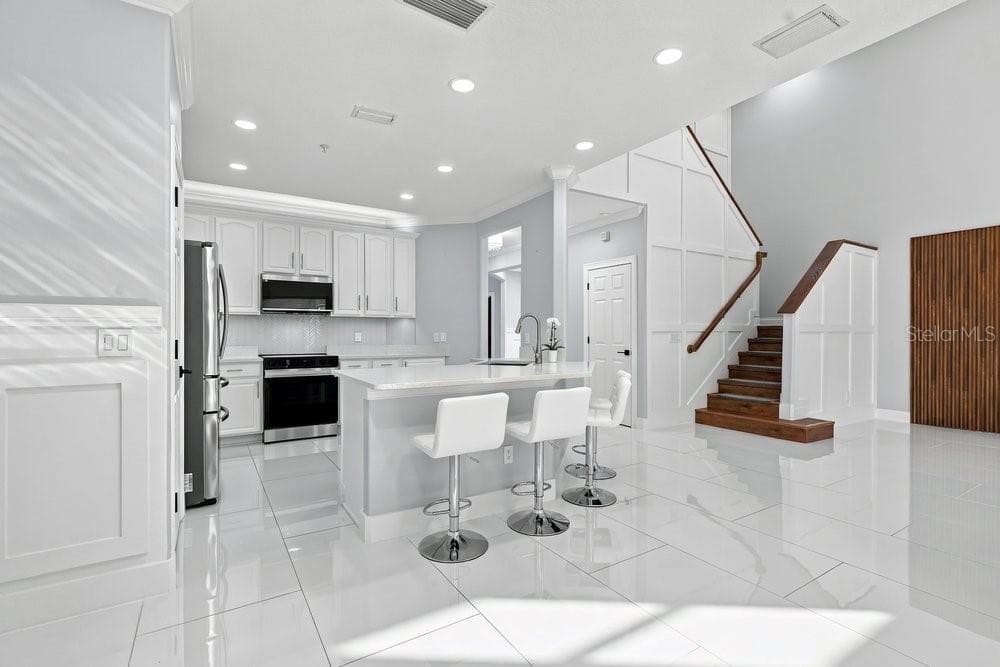 Porcelain tile throughout the first floor - 7149 REGINA WAY, ORLANDO