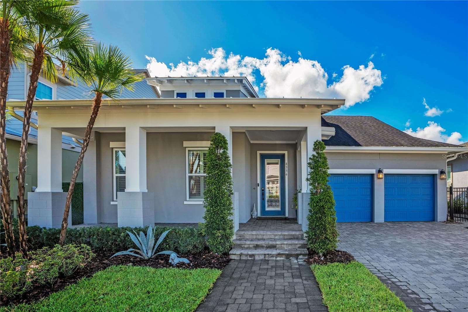 Welcome to 8336 Canetti St in Laureate Park, Lake Nona, Orlando FL 32827. A 2020 David Weekley Shalimar with contemporary curb appeal, lush palms, and a two car garage. - 8336 CANETTI ST, ORLANDO