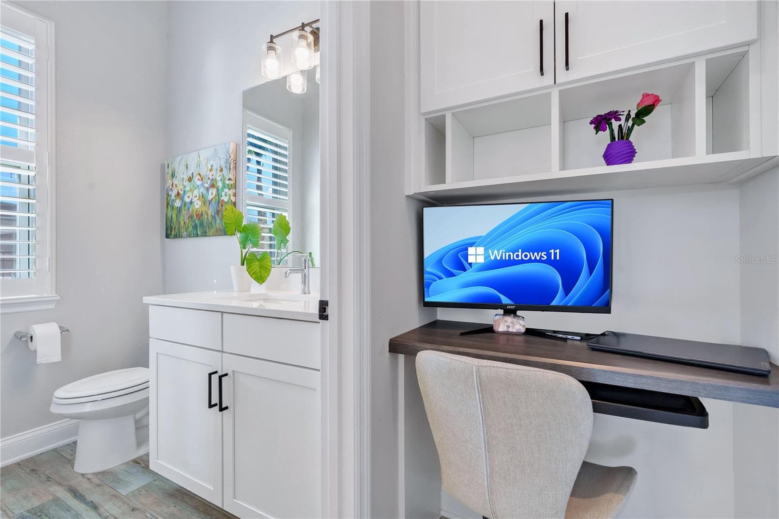 Built in office nook with desk and shelving, a functional workspace for working from home. - 8336 CANETTI ST, ORLANDO