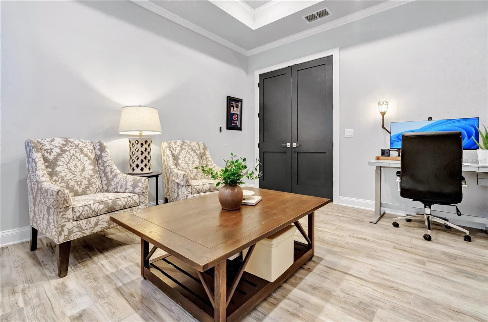 Versatile flex room ideal as a home office, den, or additional guest space. - 8336 CANETTI ST, ORLANDO