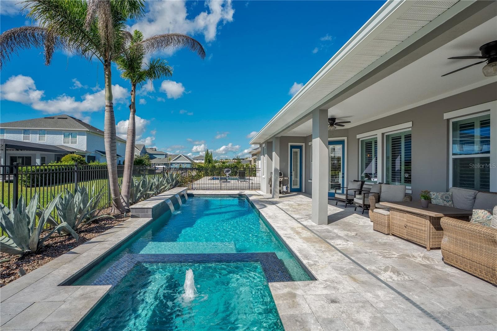 Pool deck and extended lanai with room for lounging, dining, and entertaining. - 8336 CANETTI ST, ORLANDO