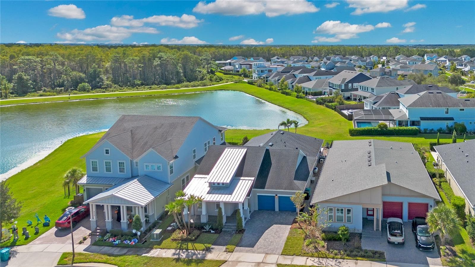 Aerial view of the home and pond frontage in Laureate Park, Lake Nona, Orlando FL 32827. - 8336 CANETTI ST, ORLANDO