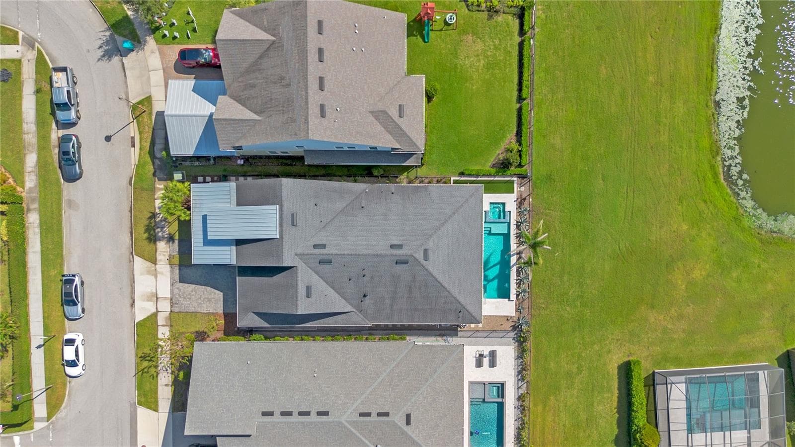 Overhead aerial showing the home, private pool, and fenced backyard. - 8336 CANETTI ST, ORLANDO