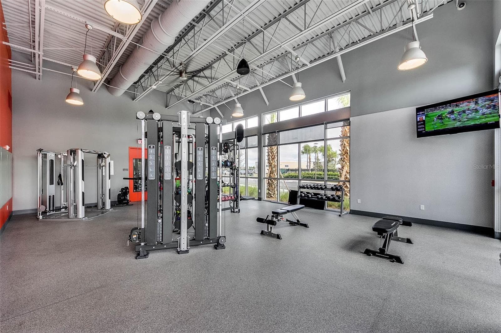 Community fitness center with strength training equipment and modern design. - 8336 CANETTI ST, ORLANDO