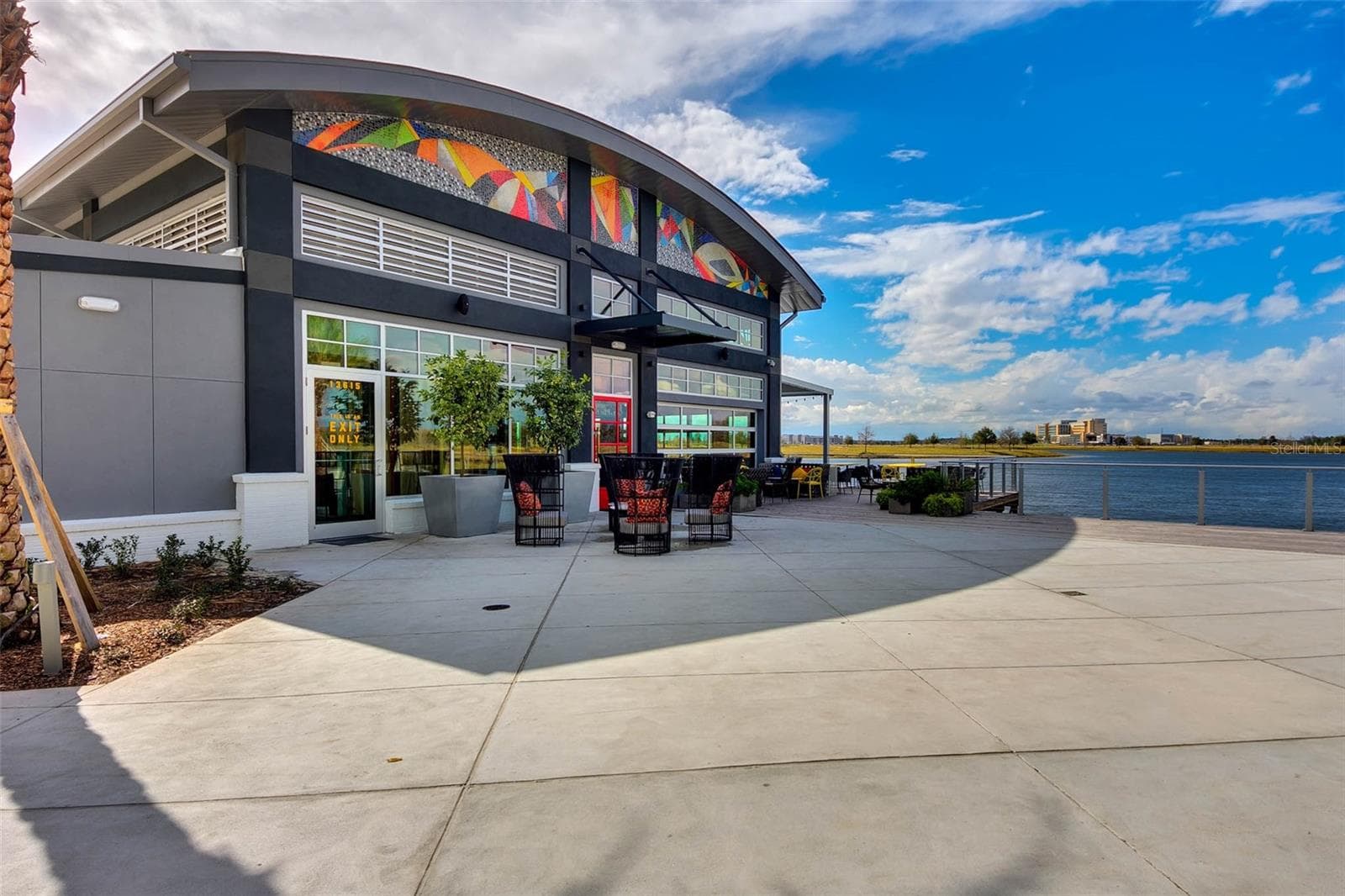 Modern amenity center with open patio space, a highlight of Lake Nona community living. - 8336 CANETTI ST, ORLANDO