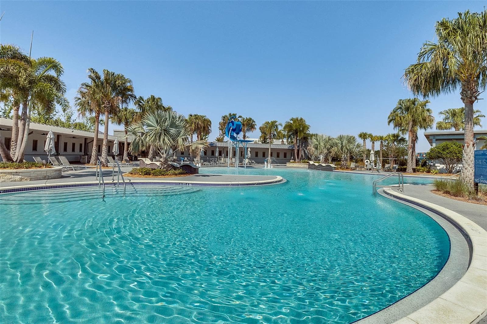 Laureate Park resort style pool with lounge deck and palm trees in Lake Nona. - 8336 CANETTI ST, ORLANDO