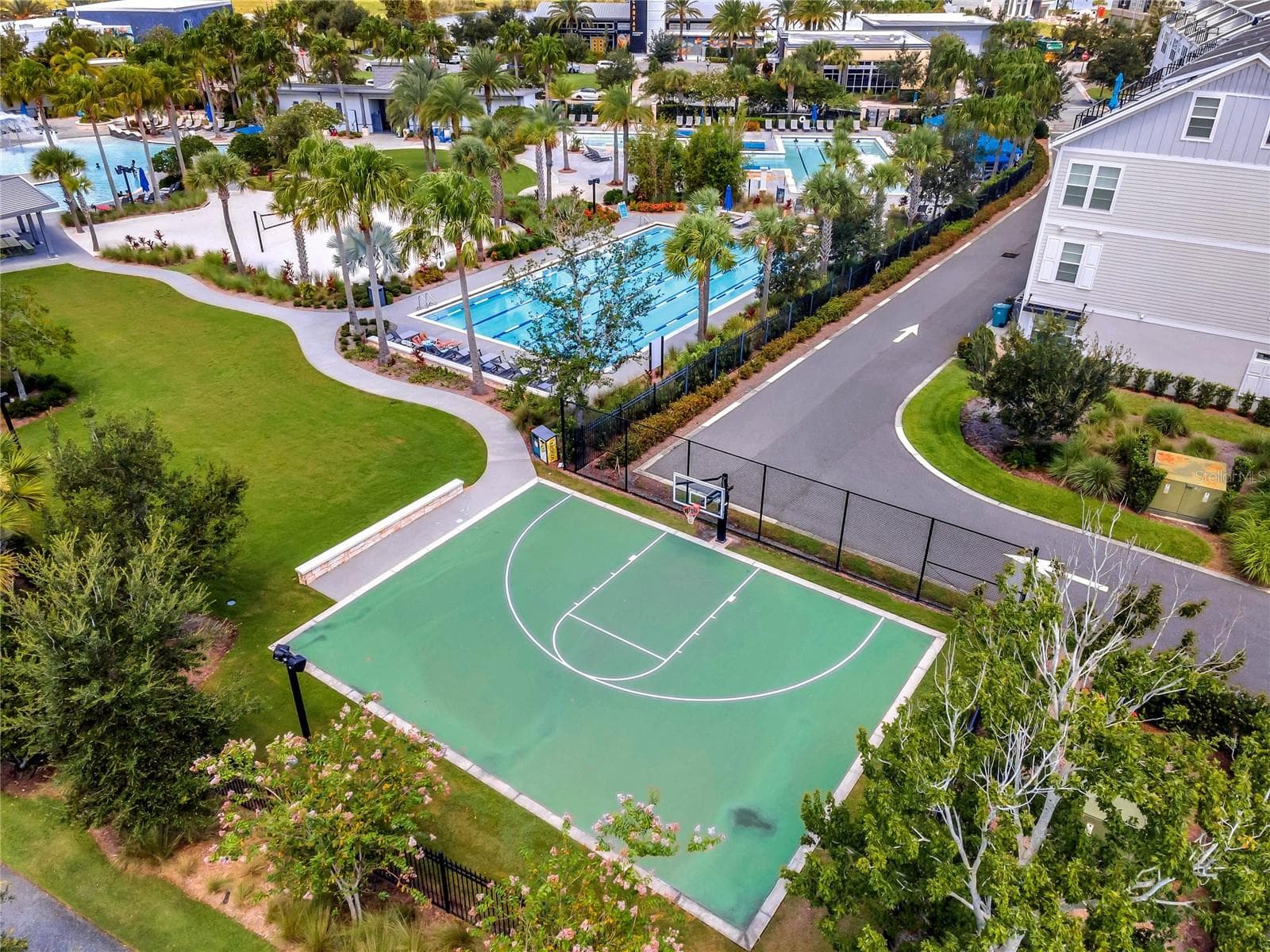 Aerial of community basketball court and pool area in Laureate Park, Lake Nona. - 8336 CANETTI ST, ORLANDO