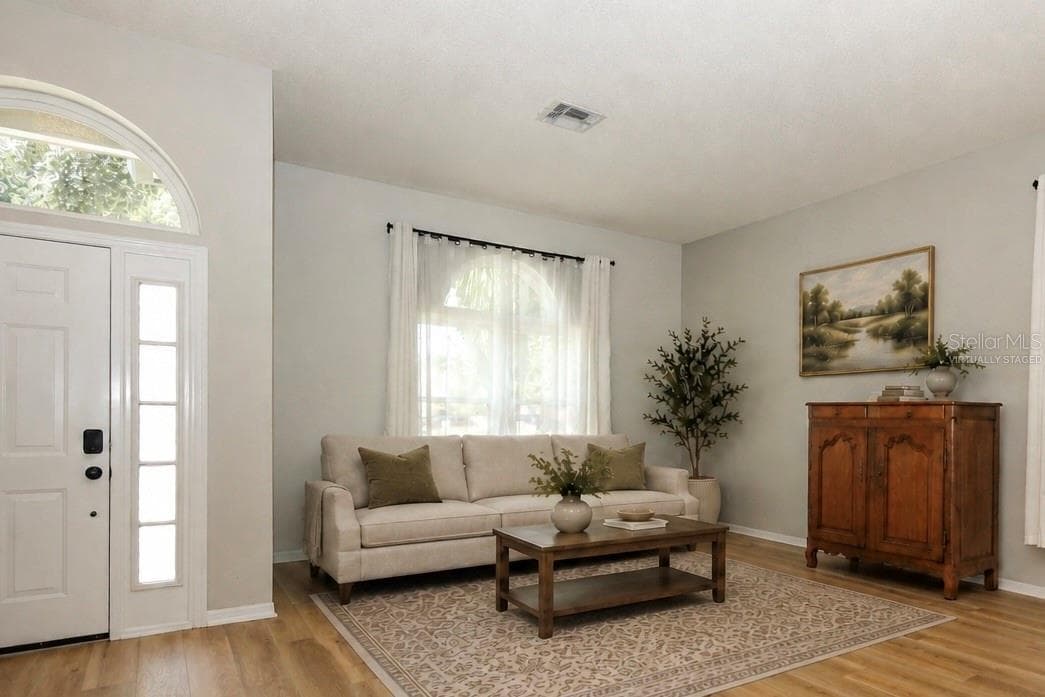 Living Room & Entry Virtually Staged - 3581 FOXCROFT CIR, OVIEDO