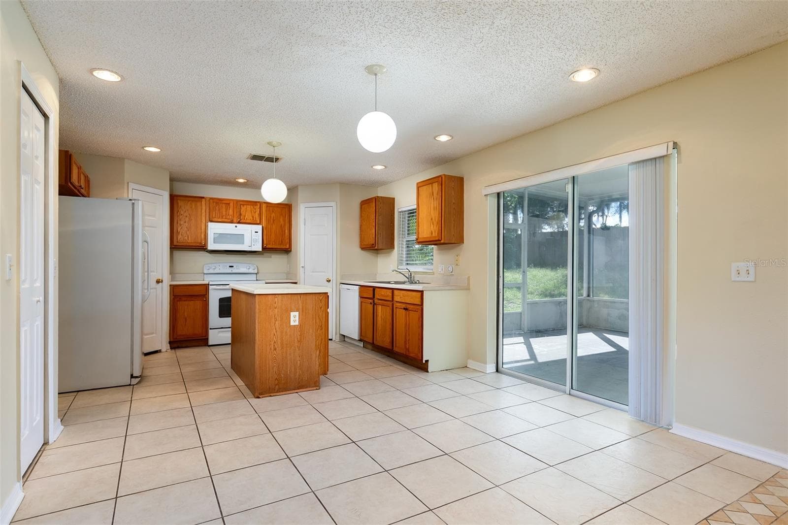 KITCHEN DINETTE AREA - 2457 ELKCAM BLVD, DELTONA