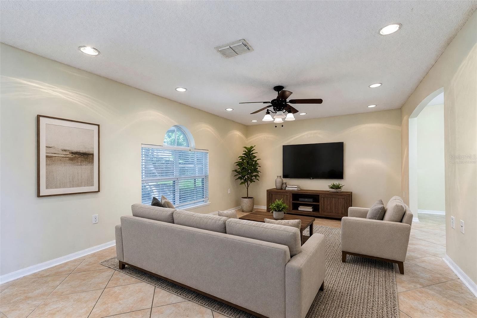VIRTUALLY STAGED FAMILY ROOM - 2457 ELKCAM BLVD, DELTONA