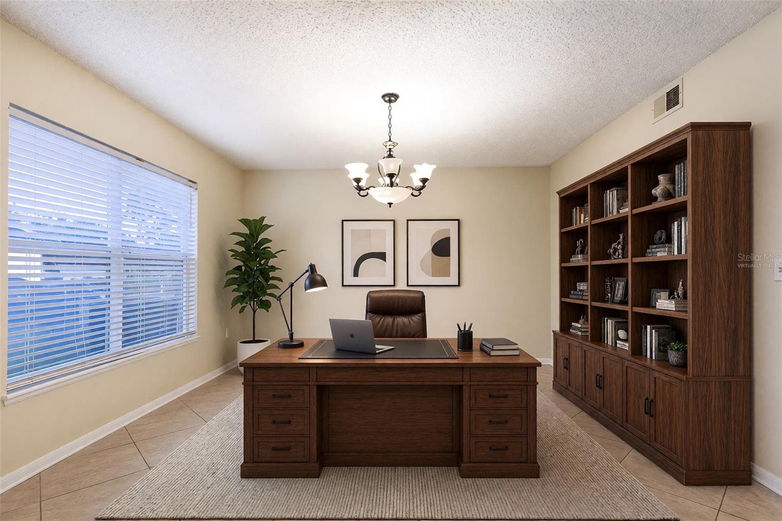 VIRTUALLY STAGED LIVING ROOM SET AS AN OFFICE - 2457 ELKCAM BLVD, DELTONA