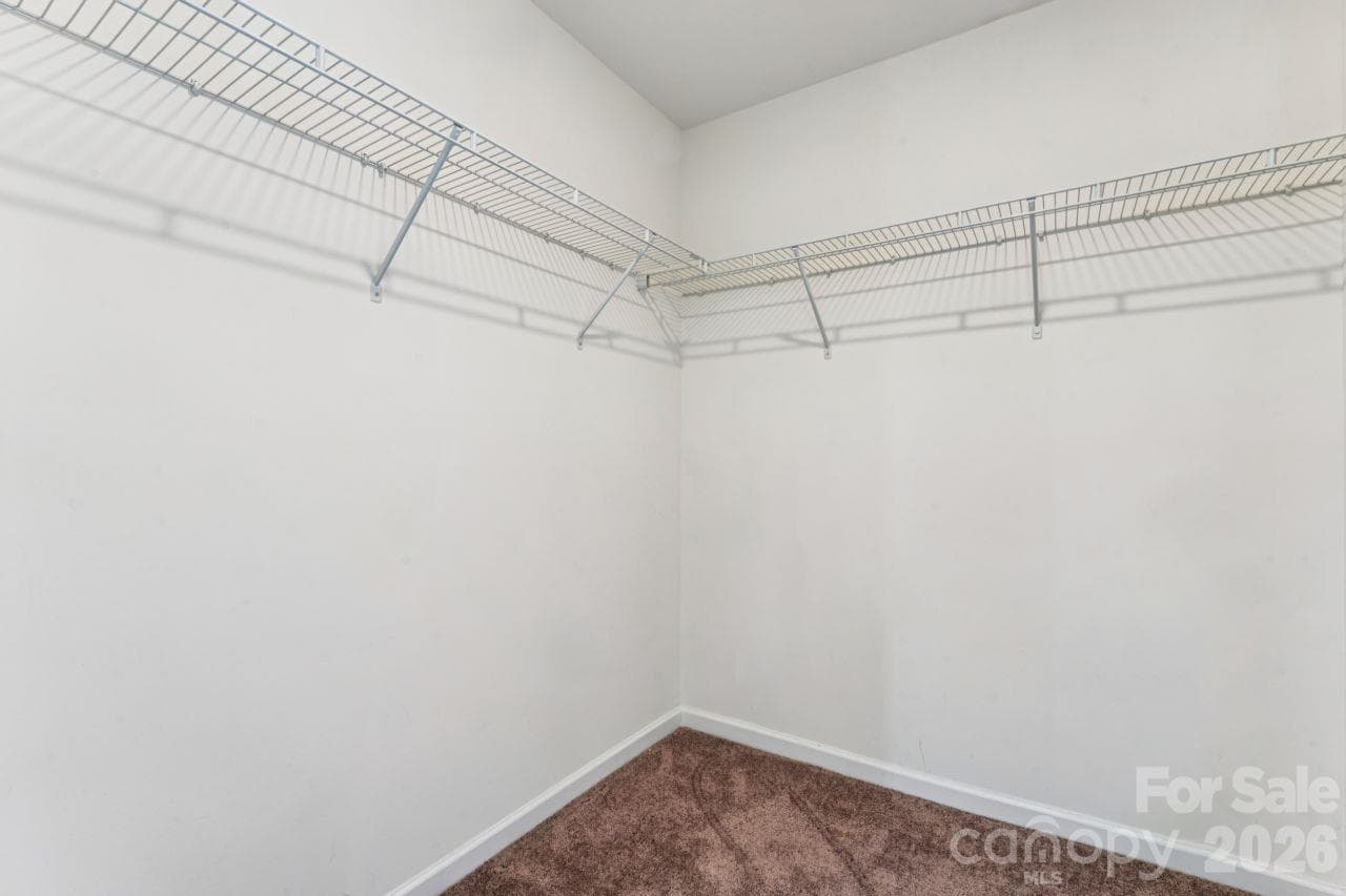 Walk-in closet in primary bedroom - 2625 Trinity Street, Monroe