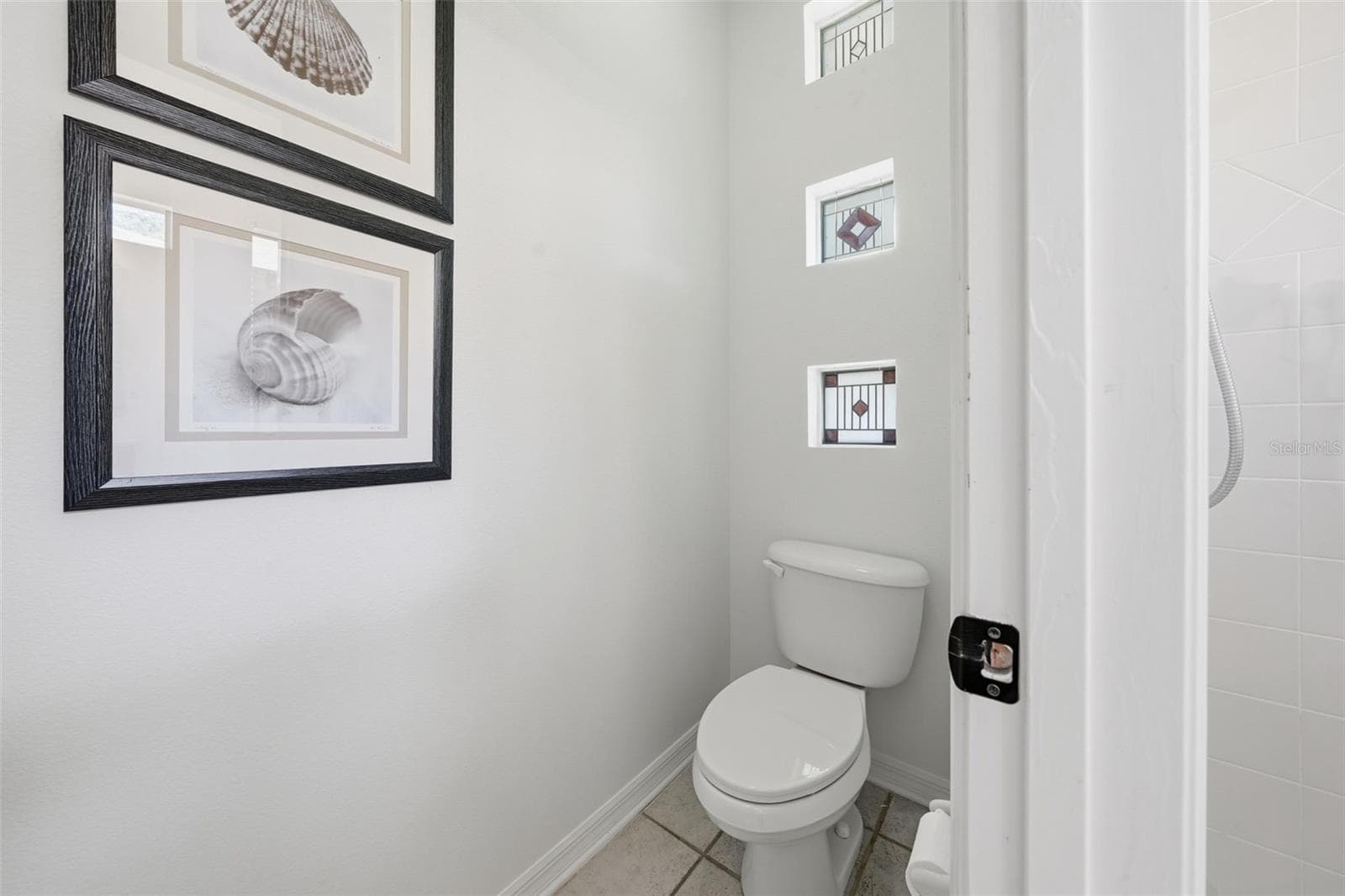 WATER CLOSET IN THE PRIMARY BATHROOM - 13850 BLUEWATER CIR, ORLANDO