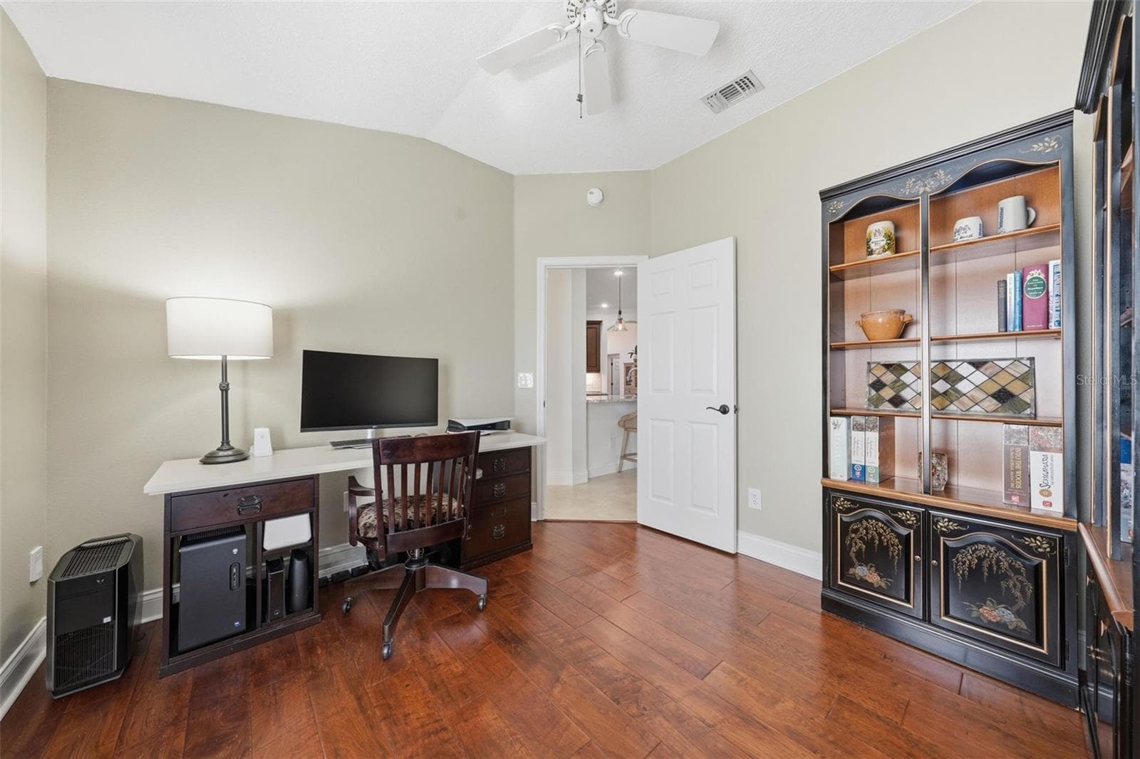 BEDROOM BEING USED AS AN OFFICE CURRENTLY with ENGINEERED HARDWOOD FLOORING - 13850 BLUEWATER CIR, ORLANDO